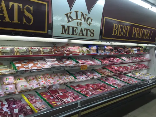 Tilton Market's fresh meat case under its King of Meats sign