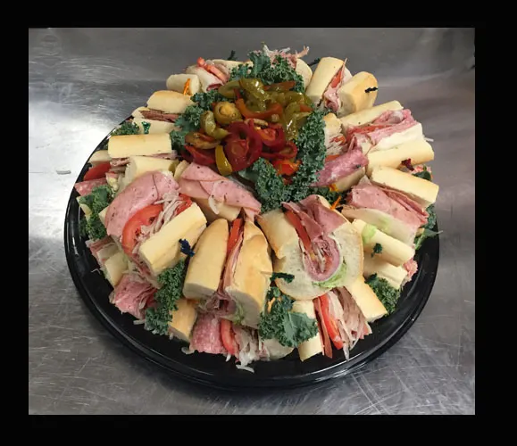 A Tilton Market hoagie tray arranged with lettuce and tomatoes