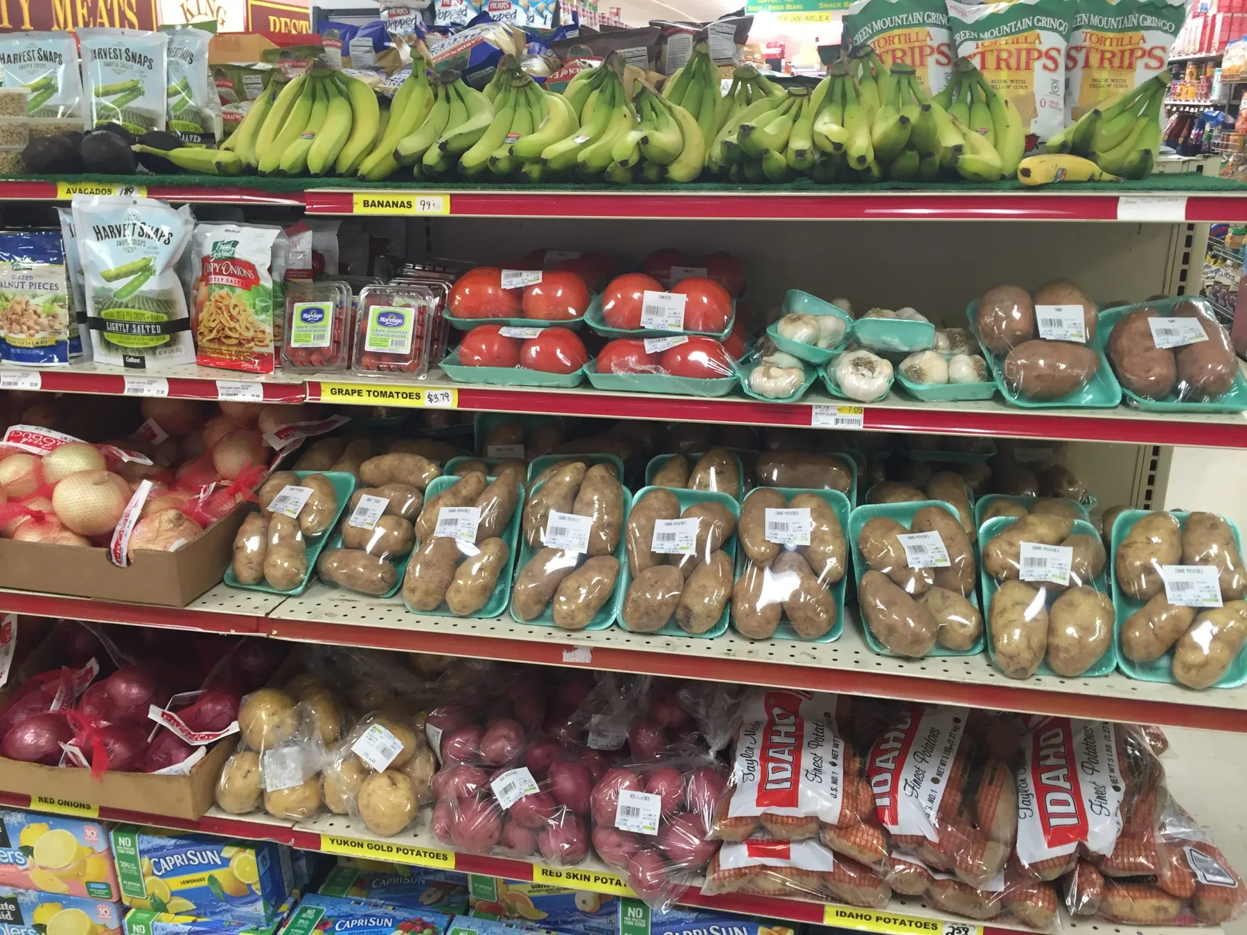 Fresh vegetables and potatoes in the produce aisle at Tilton Market